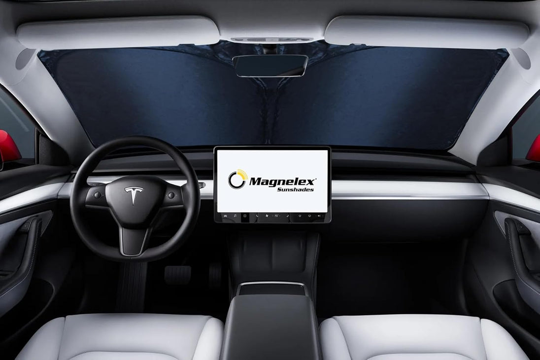Windshield sunshade installed car interior with a Magnelex logo on a screen