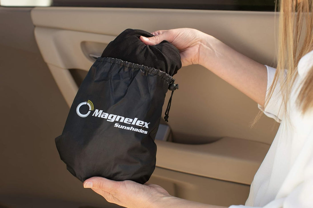 “A hand placing a compact Magnelex sunshade storage pouch into a car door pocket, highlighting easy storage and portability.”