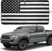 Black and white American flag windshield sunshade shown on a Toyota Tacoma pickup.