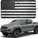 Black and white American flag windshield sunshade shown on a Toyota Tacoma pickup.