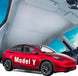 Red Tesla Model Y car with 'Model Y' text on a clear background and a Tesla Model Y Roof Sunshade