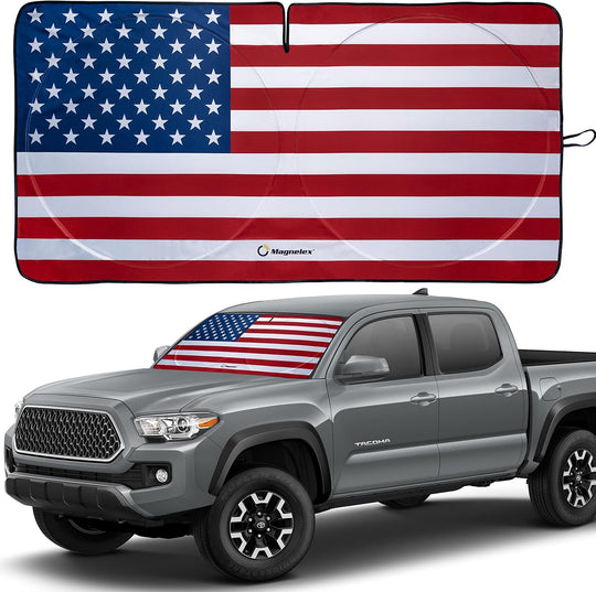 Patriotic American flag sunshade displayed on a Toyota Tacoma pickup.