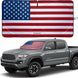 Patriotic American flag sunshade displayed on a Toyota Tacoma pickup.